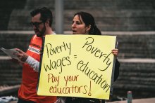 Student holding sign at TAU rally, Photo Credit: Brandon Goldner 